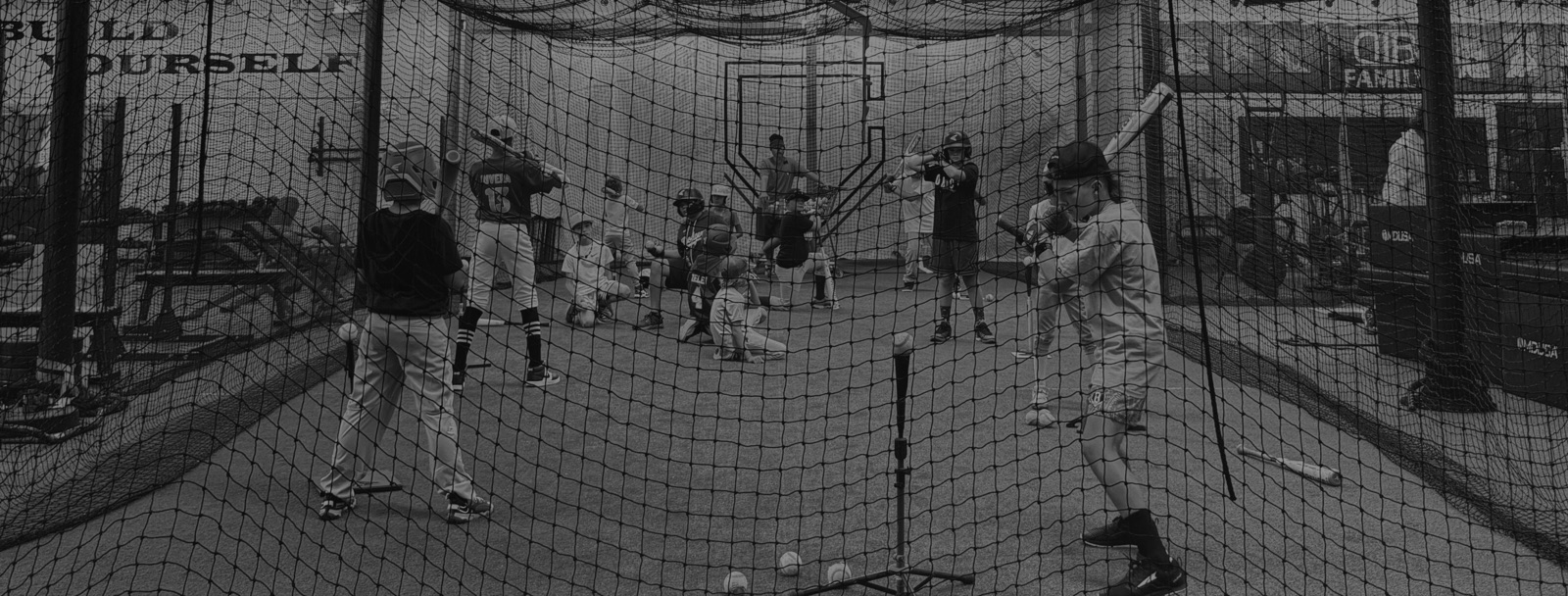 Young players taking swings in the netted batting cages at The Clubhouse 831